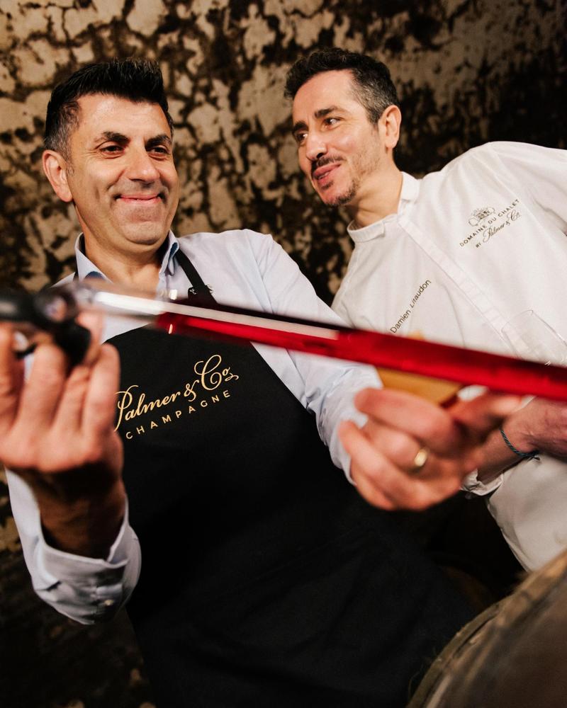 Xavier Berdin and Damien Litaudon extracting a sample of Rosé Solera with a pipette