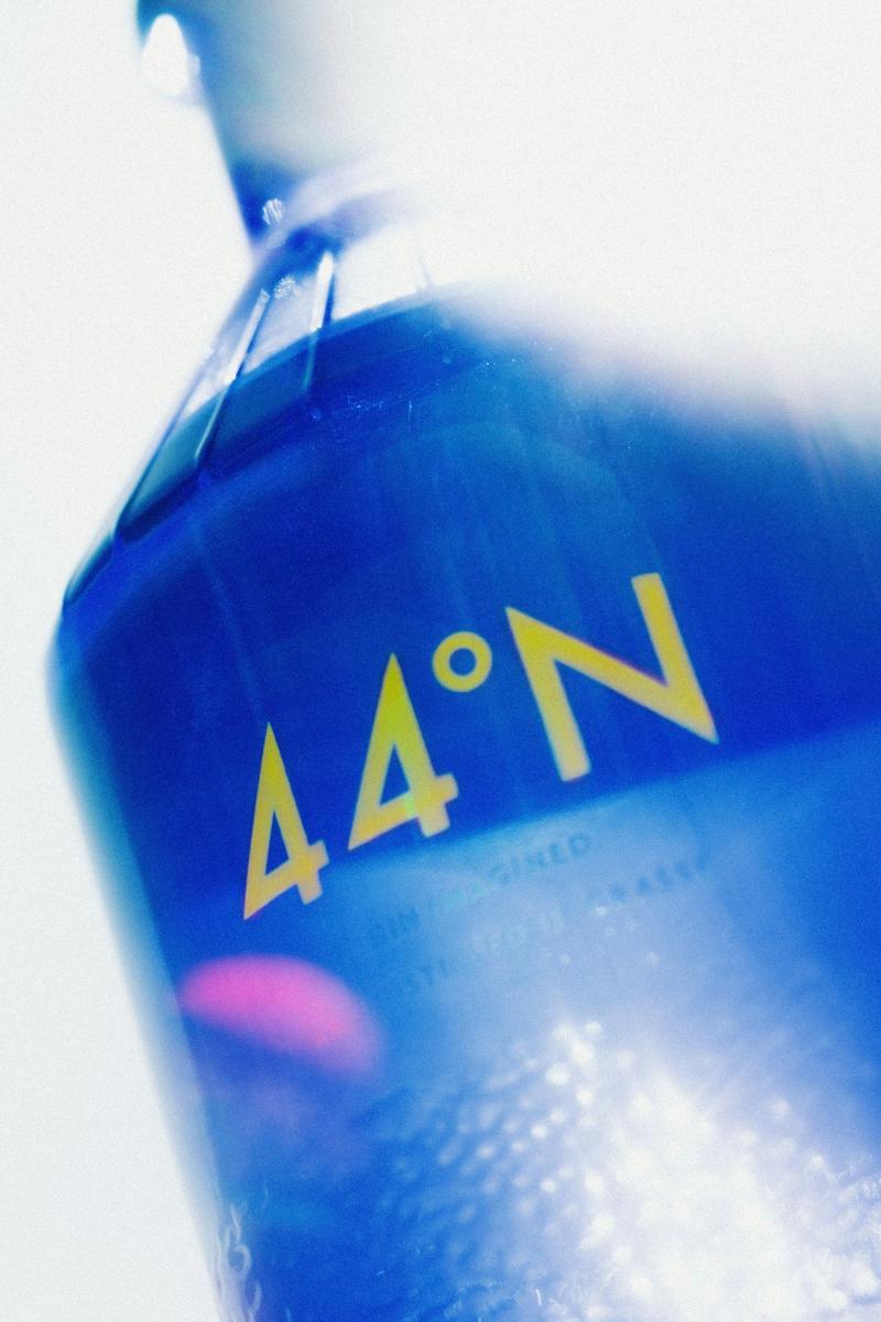 Close up of bottle of Gin 44 with sunlight flares shining through