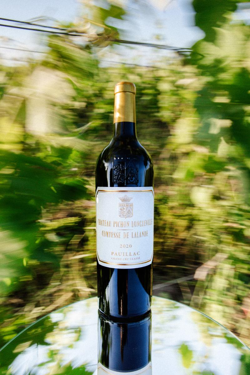 Macro of Pichon Comtesse wine bottle capsule with movement blur