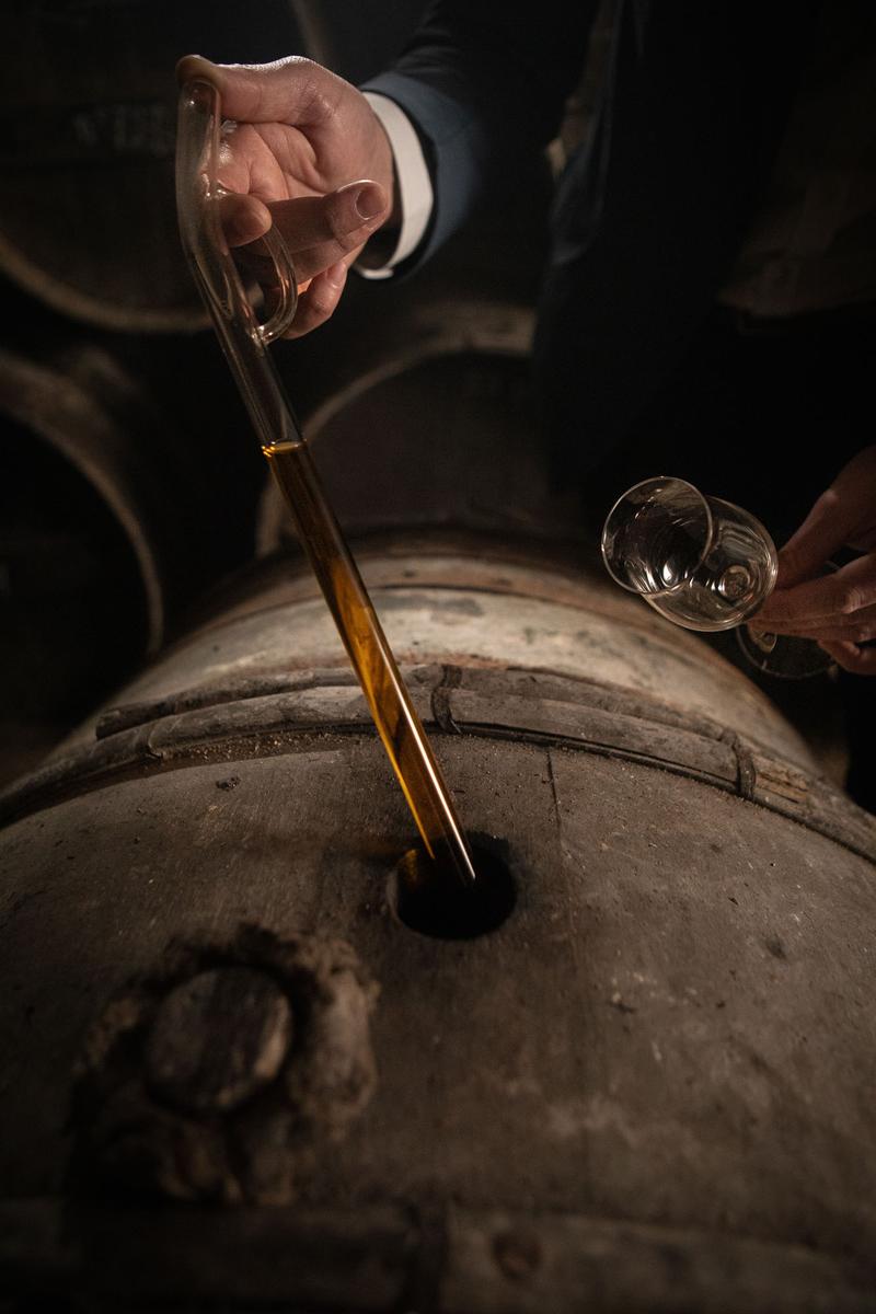 Close up of pipette used to extract a sample of Cognac Tesseron Experience from an old cask